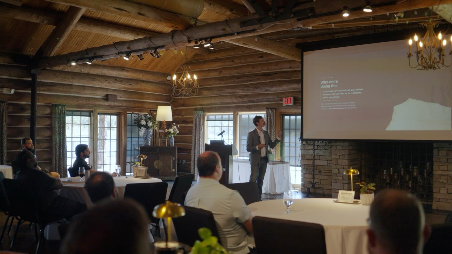 A presentation to the full team in the lodge’s main room at the 2026 all-hands