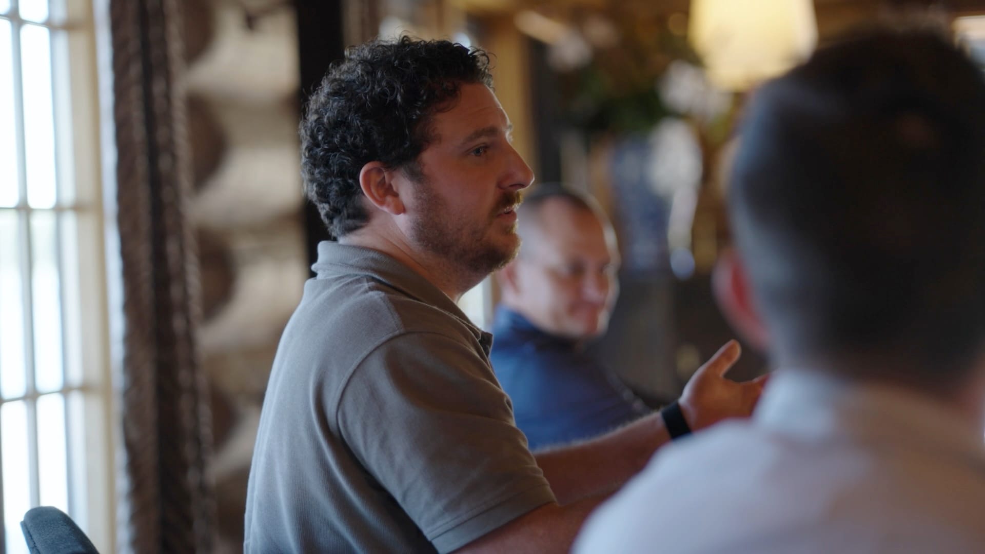 A team member making a point in a small-group conversation