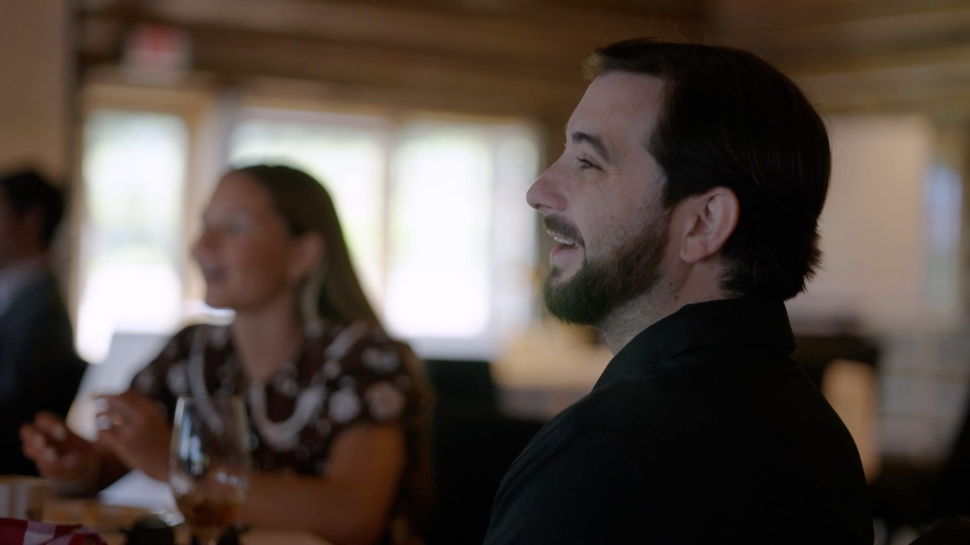 Team members in conversation around a table