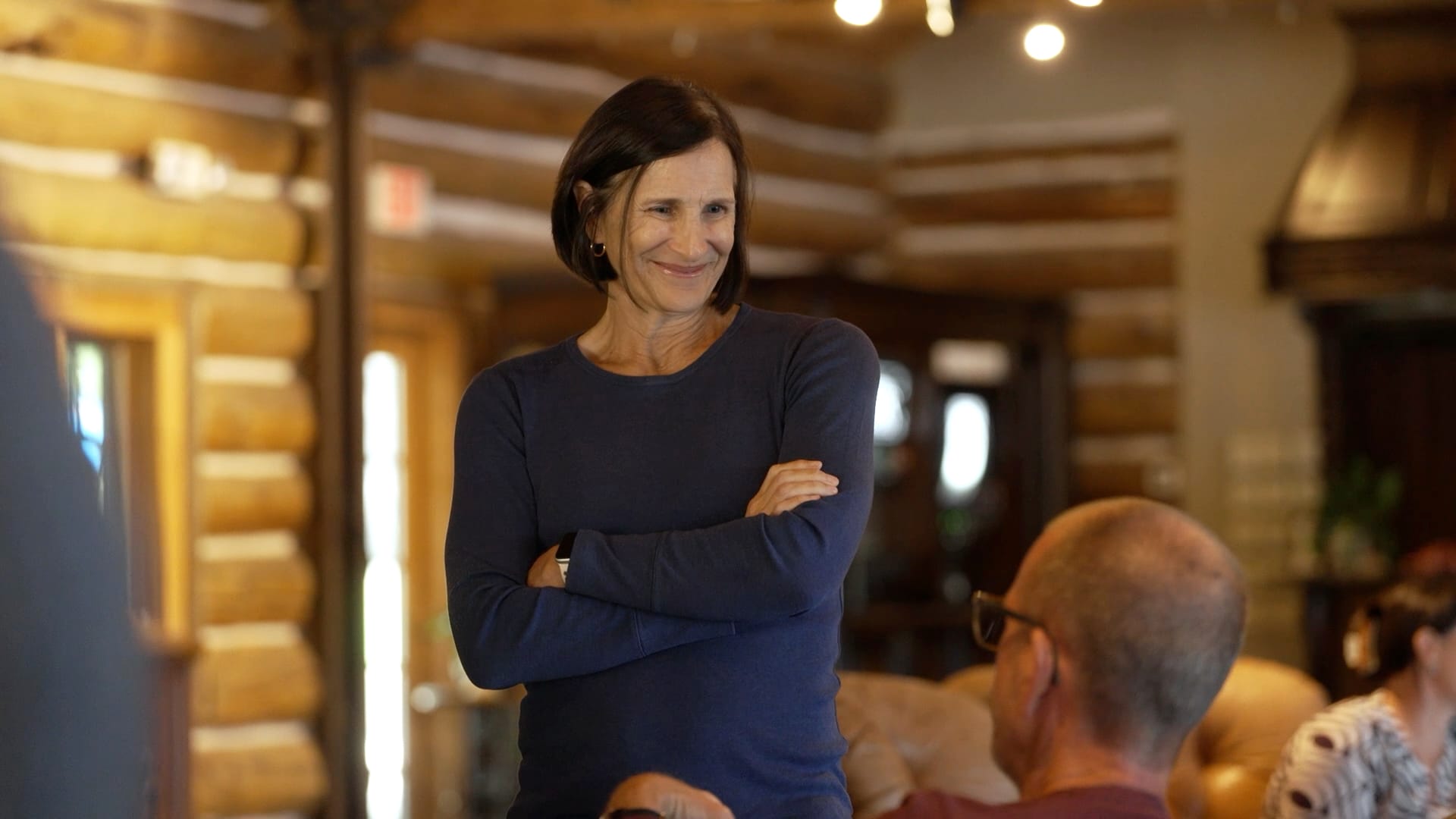 Dana Dudley smiling in conversation at the 2026 all-hands