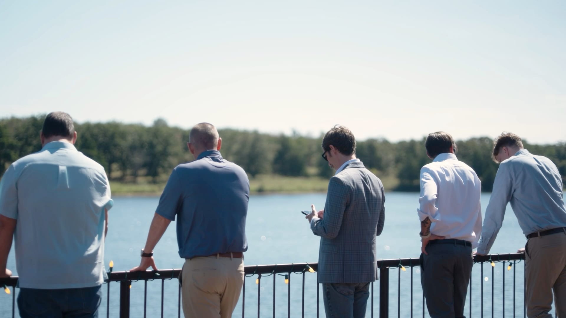 SEQTEK team members at a lakeside railing during the 2026 all-hands